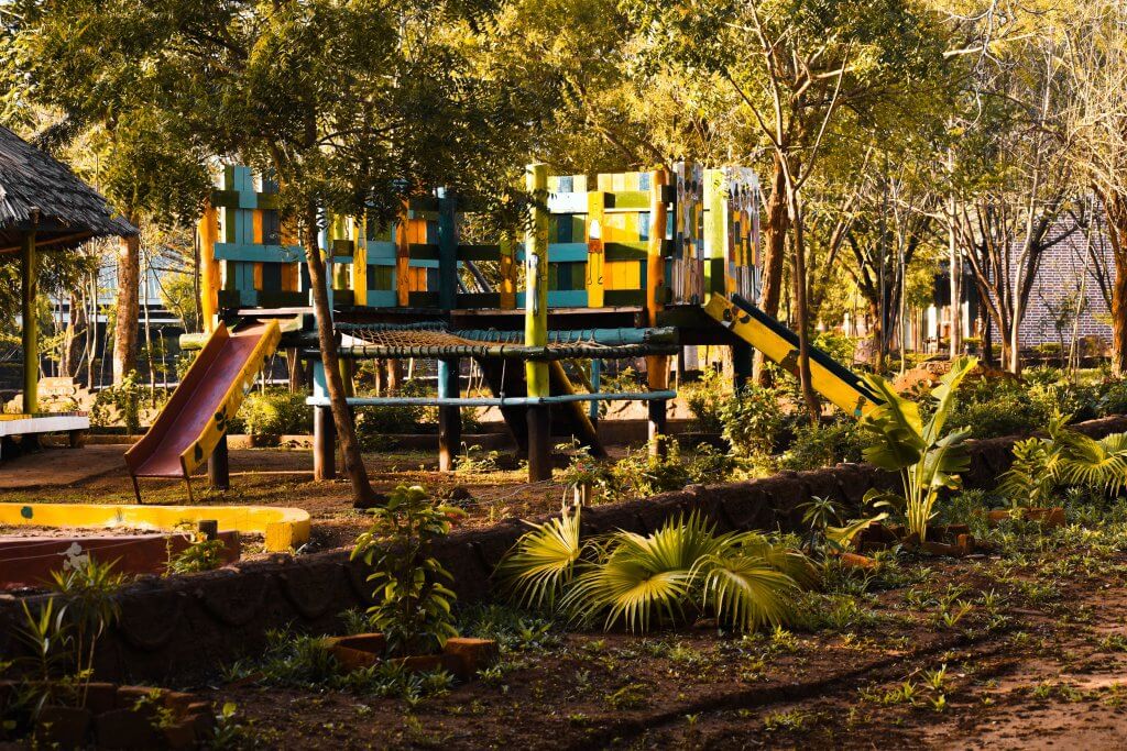 A colourful kids' playground in a jungle.